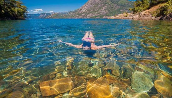 Clear waters and mountain scenery at a Lake Lácar beach